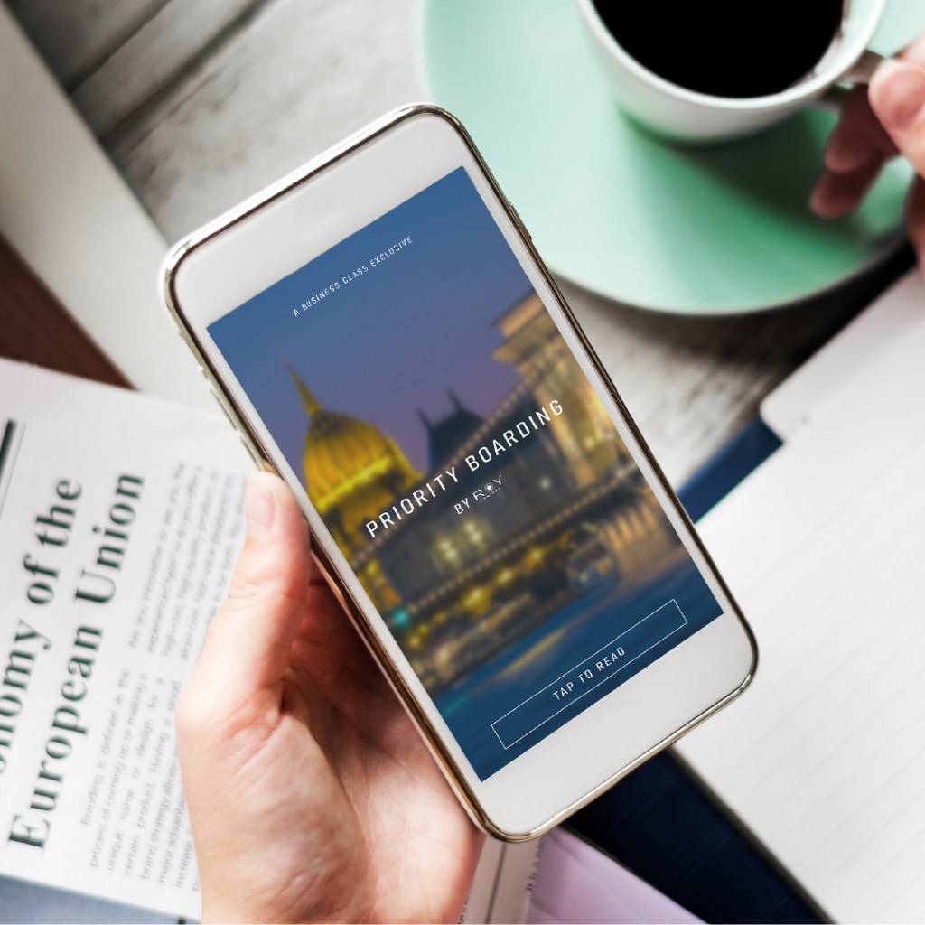 Priority Boarding by RoyPrints displayed on a mobile screen, the monthly travel newsletter exclusive to Business Class members